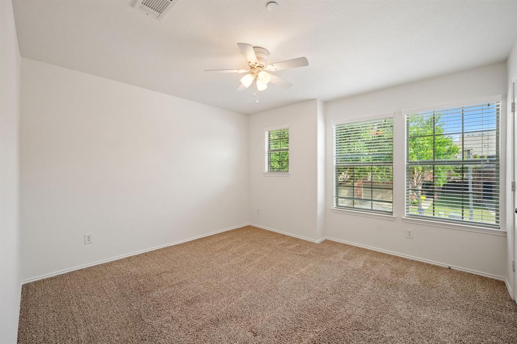1013 Lucy Lane Allen, TX 75013 - Photo 23 of 30 a view of a livingroom with a ceiling fan and window