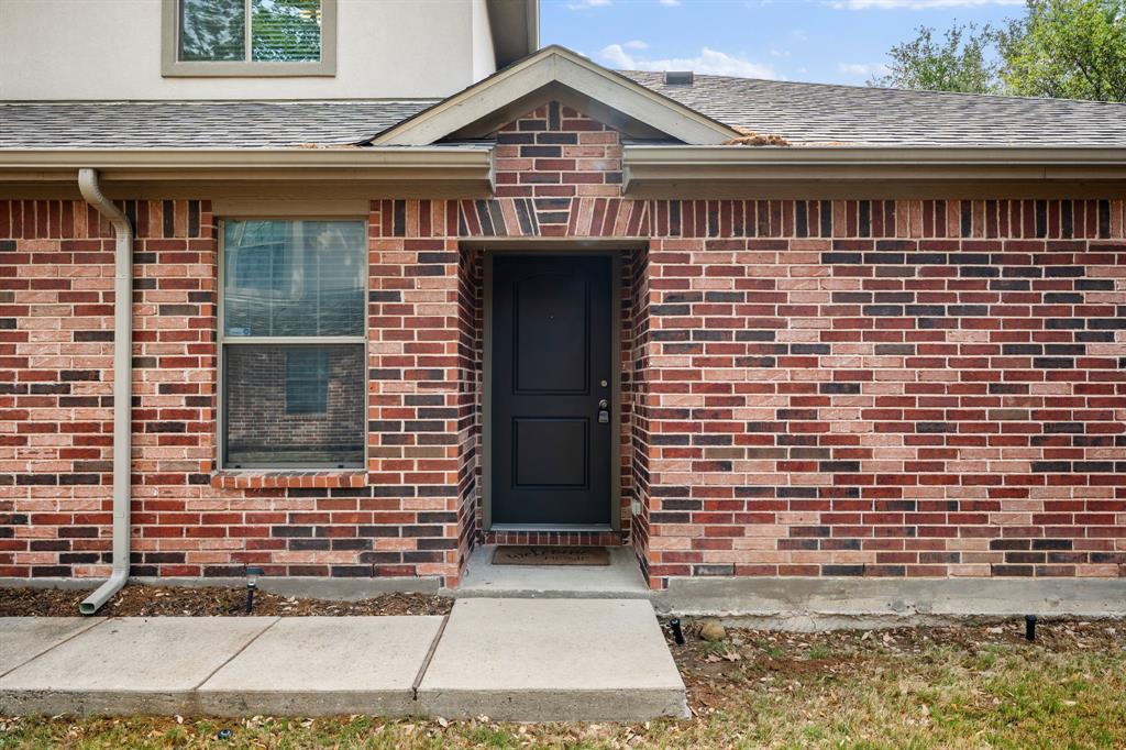 1013 Lucy Lane Allen, TX 75013 - Photo 4 of 30 a front view of a house with a garage