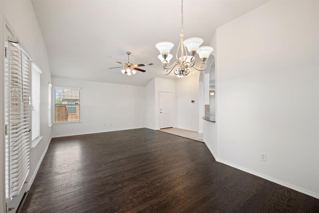 1013 Lucy Lane Allen, TX 75013 - Photo 7 of 30 an empty room with wooden floor and windows