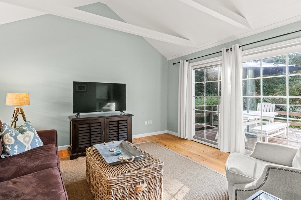 218 Scudder Road Barnstable, MA 02655 - Photo 11 of 36 a living room with furniture and a flat screen tv