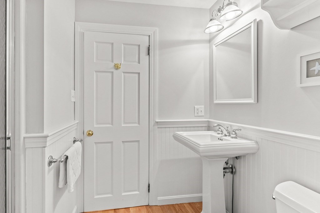 218 Scudder Road Barnstable, MA 02655 - Photo 13 of 36 a bathroom with a sink a mirror and a bathtub