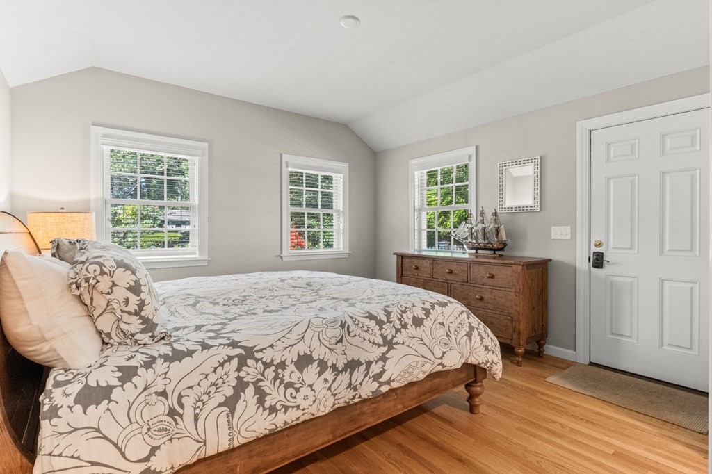 218 Scudder Road Barnstable, MA 02655 - Photo 16 of 36 a bedroom with a large bed and a window