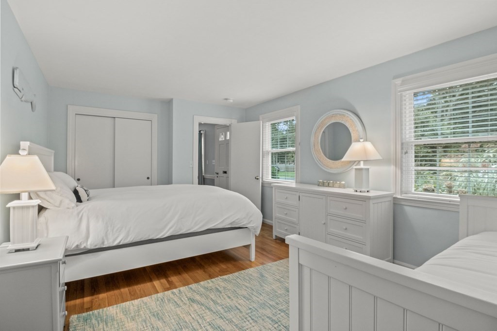 218 Scudder Road Barnstable, MA 02655 - Photo 19 of 36 a bedroom with a large bed and a window