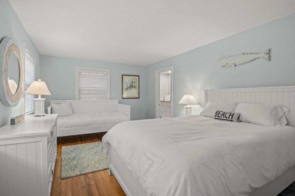 218 Scudder Road Barnstable, MA 02655 - Photo 20 of 36 a bedroom with a bed and a lamp