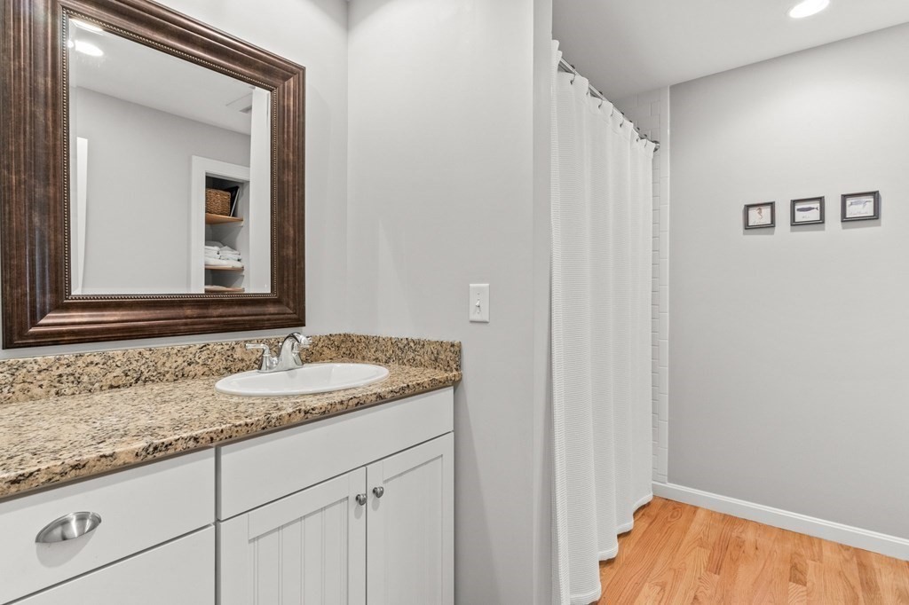 218 Scudder Road Barnstable, MA 02655 - Photo 21 of 36 a bathroom with a sink and a mirror