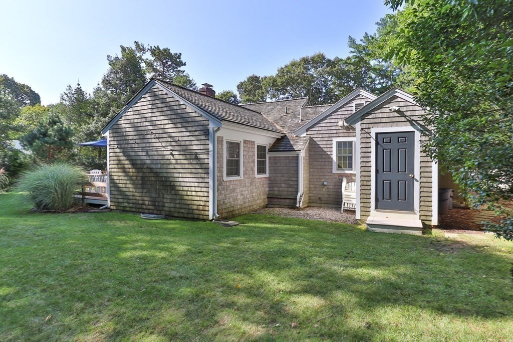 218 Scudder Road Barnstable, MA 02655 - Photo 26 of 36 a front view of a house with a yard
