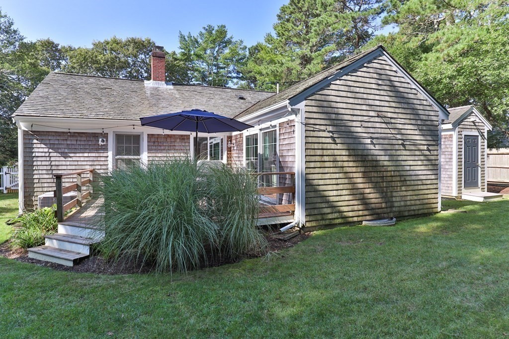 218 Scudder Road Barnstable, MA 02655 - Photo 32 of 36 a view of a house with a yard and plants
