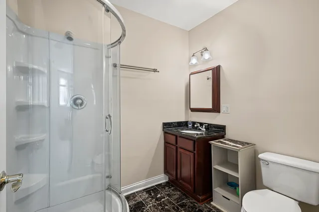 a front view of a building with parking