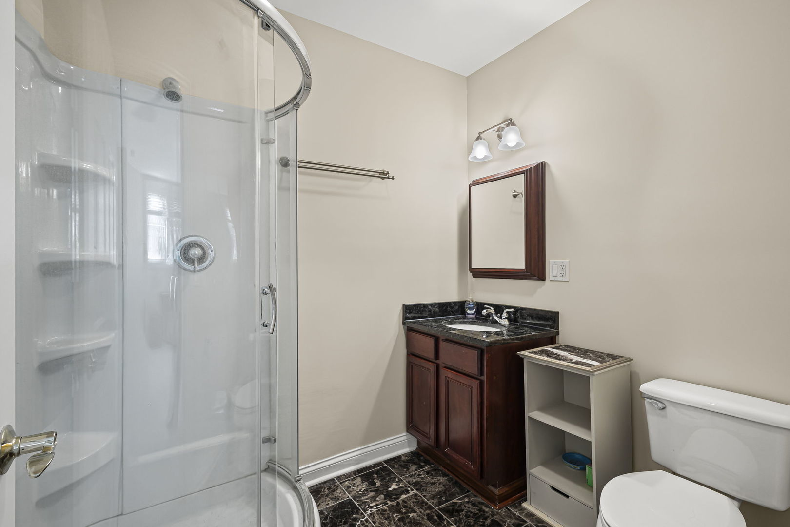 2005 Valor Court Glenview, IL 60026 - Photo 14 of 15 a bathroom with a granite countertop sink toilet and shower