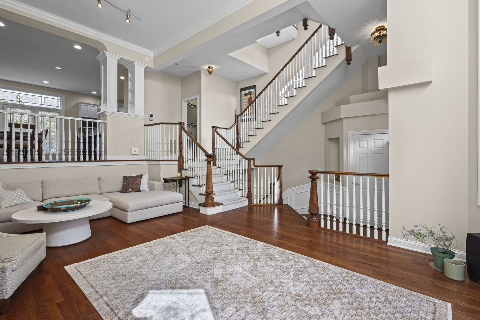 2005 Valor Court Glenview, IL 60026 - Photo 3 of 15 a living room with couches and a dining table with wooden floor