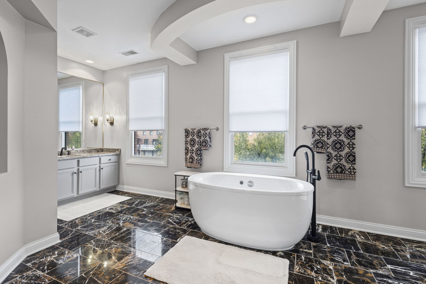 2005 Valor Court Glenview, IL 60026 - Photo 9 of 15 a spacious bathroom with a bathtub and sink