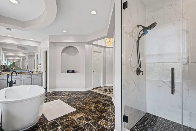 a living room with furniture fireplace and a large window