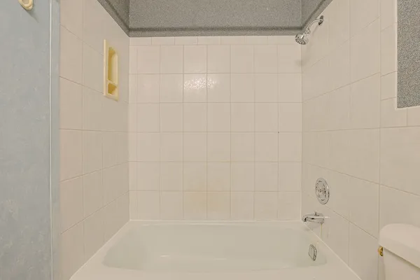 a close up of a bathtub curtain