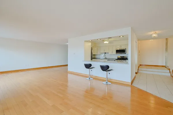 a view of a living room kitchen with a sink and a view of living room