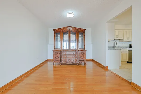 a workspace room with furniture and wooden floor