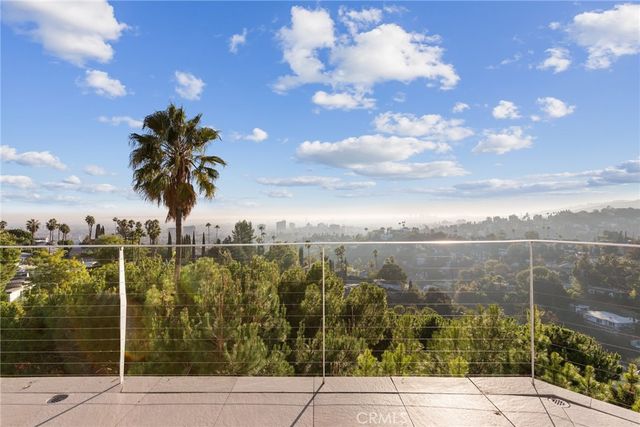 an aerial view of residential building with green space