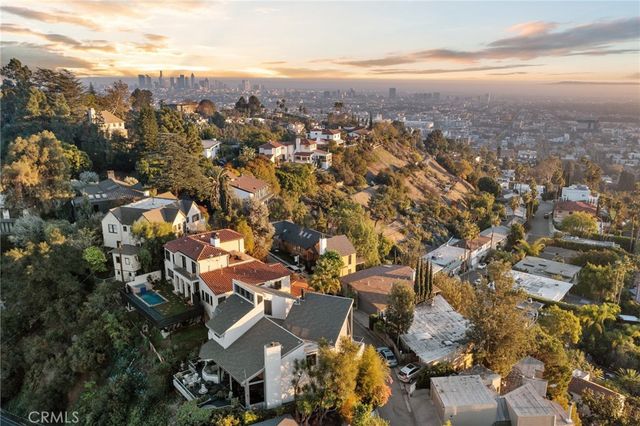 a bathroom with a double vanity sink mirror and toilet