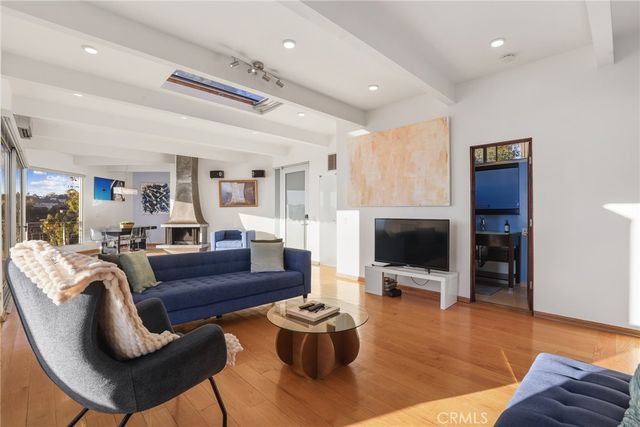 a bedroom with a bed and a television