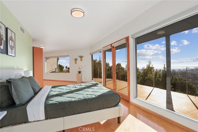 a living room with fireplace furniture and a large window