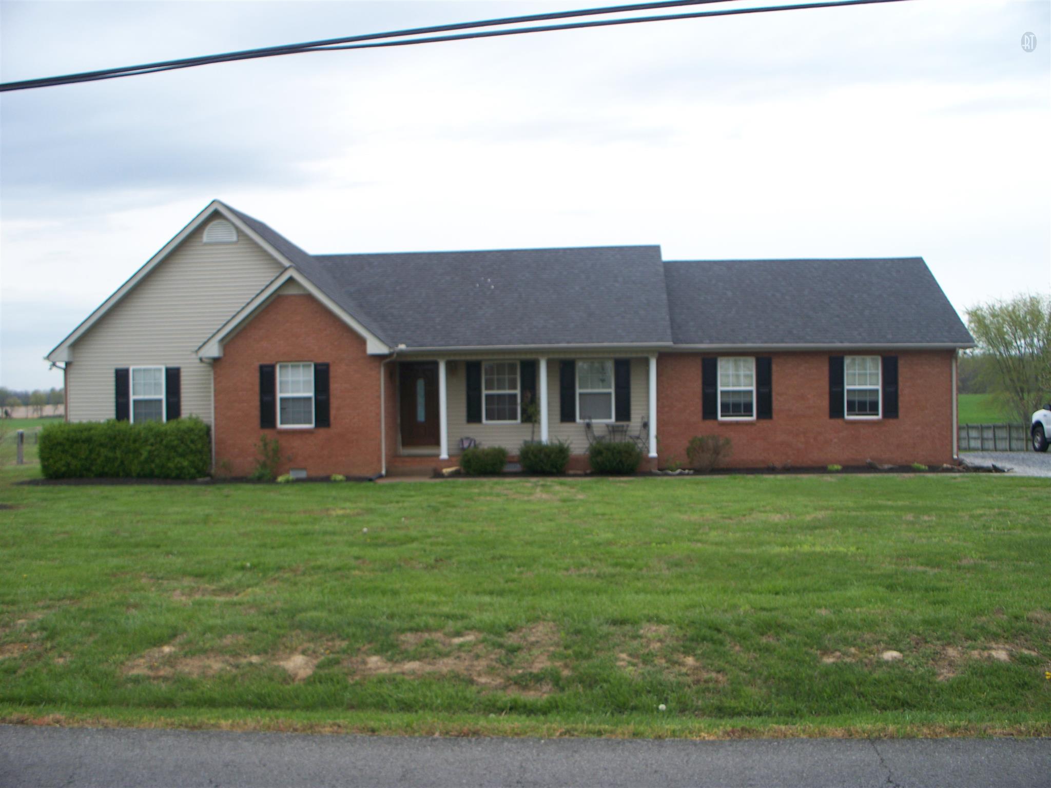 166 Cook Road Portland, TN 37148 - Photo 8 of 11 a front view of a house with a garden