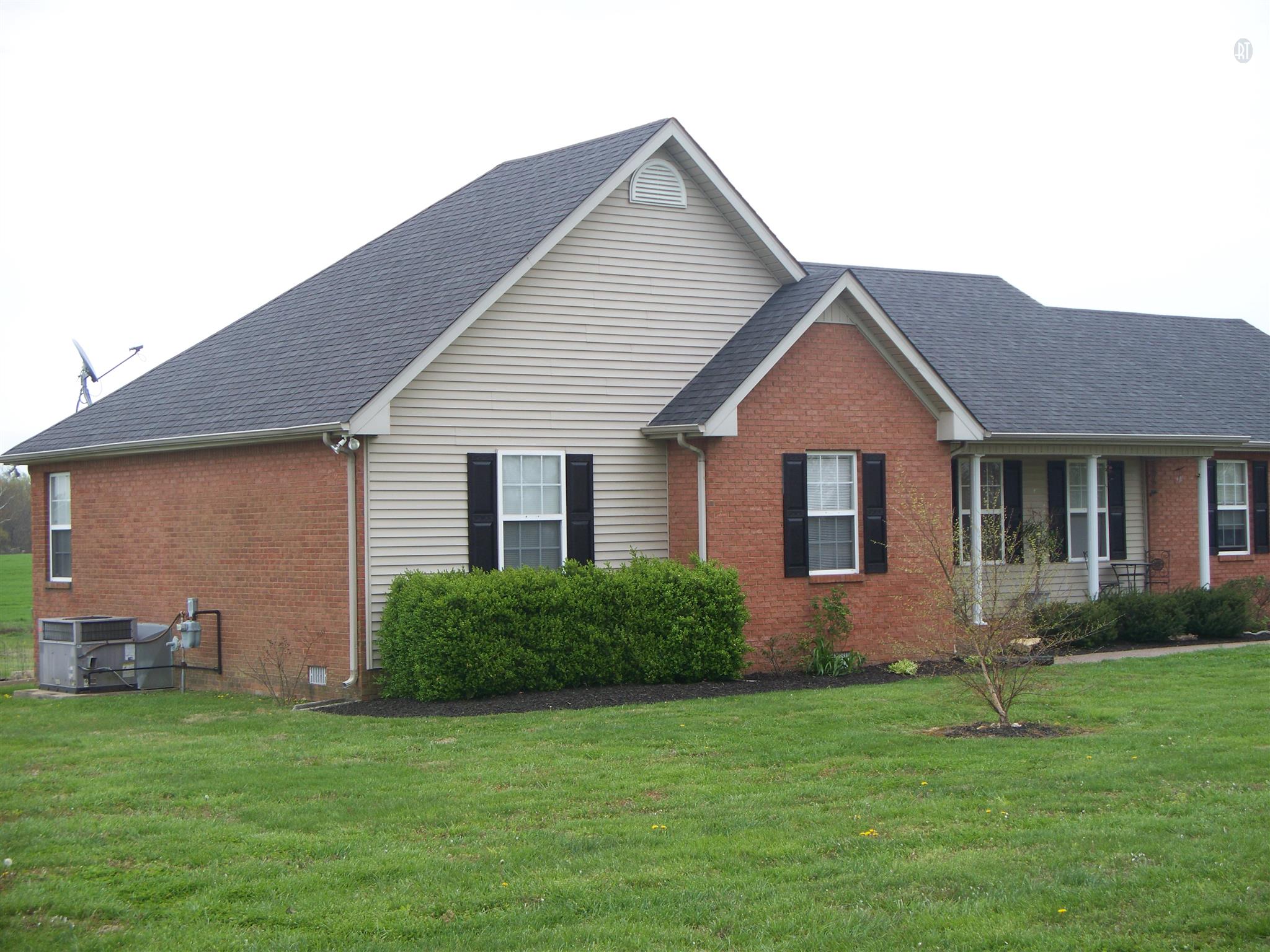 166 Cook Road Portland, TN 37148 - Photo 10 of 11 a front view of a house with a yard and garage