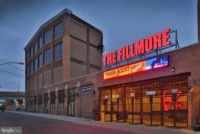 a group of people sitting in a yard