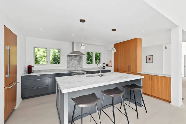 a kitchen with a table and chairs in it