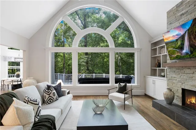 a living room with furniture and a large window