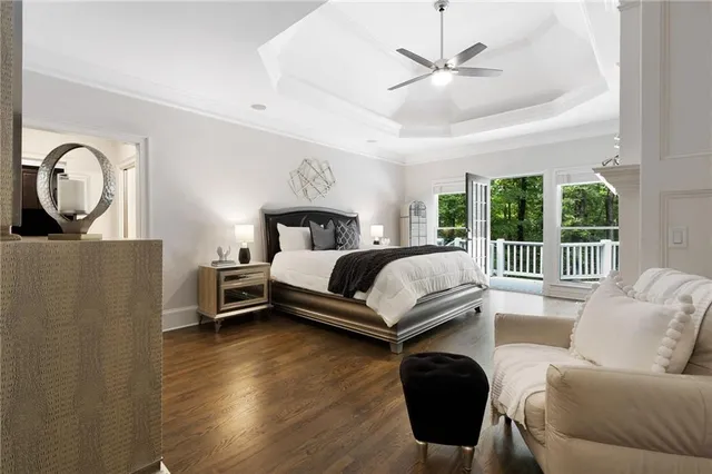 a bedroom with a bed couch and window