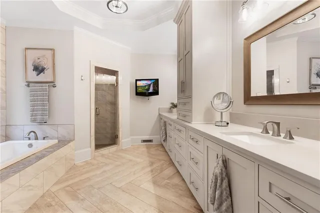 a spacious bathroom with a double vanity sink double mirror