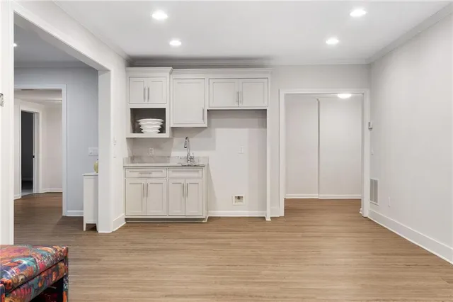 a kitchen with stainless steel appliances a refrigerator and a stove top oven
