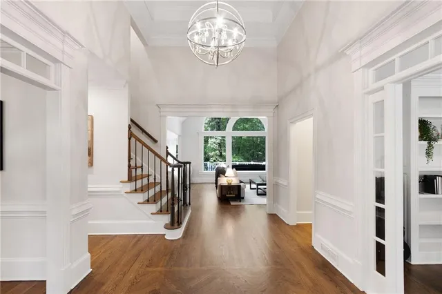 a view of an entryway with wooden floor
