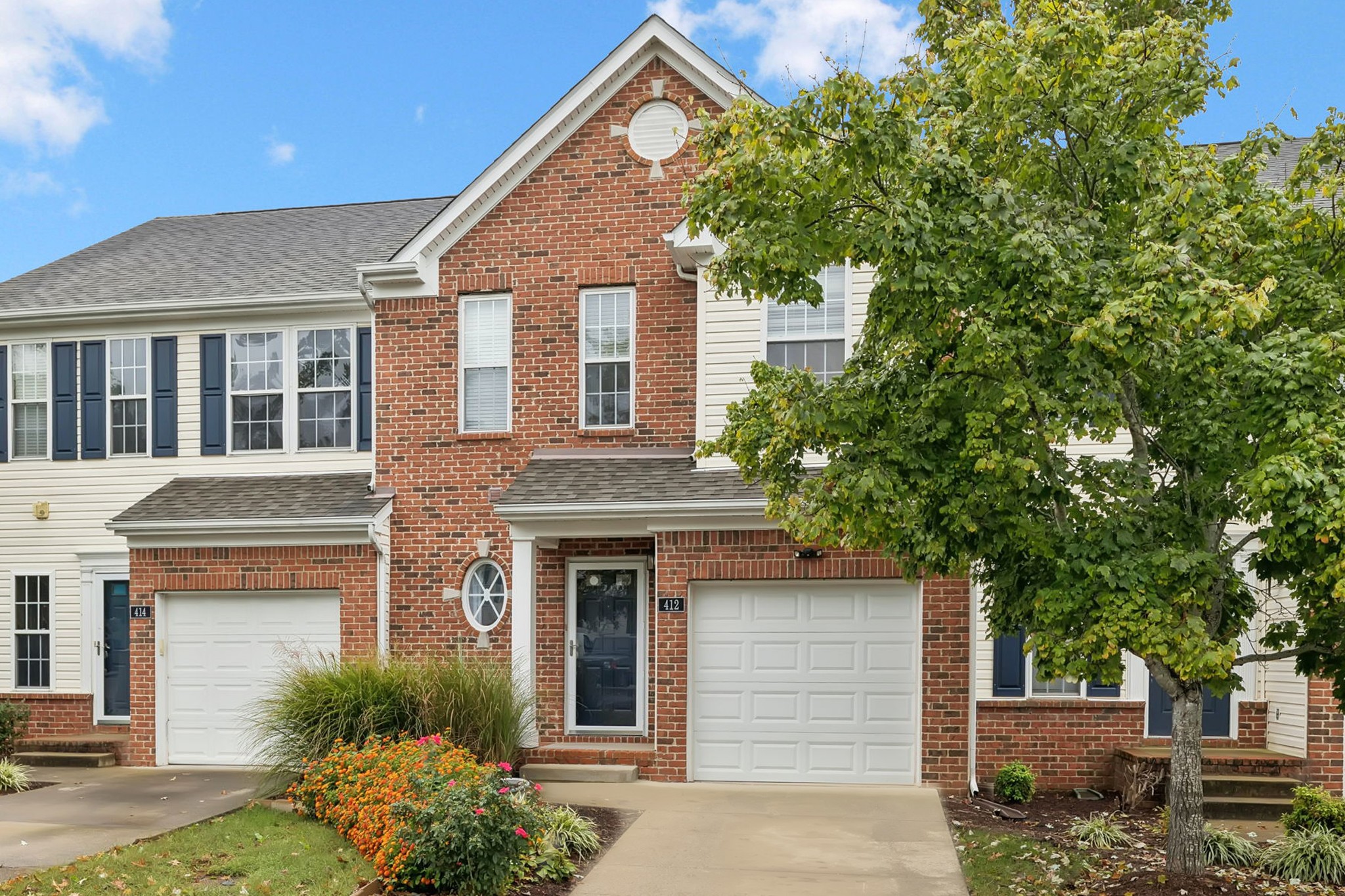 1345 Bell Road, Unit 412 Antioch, TN 37013 - Photo 1 of 33 a front view of a house with garden
