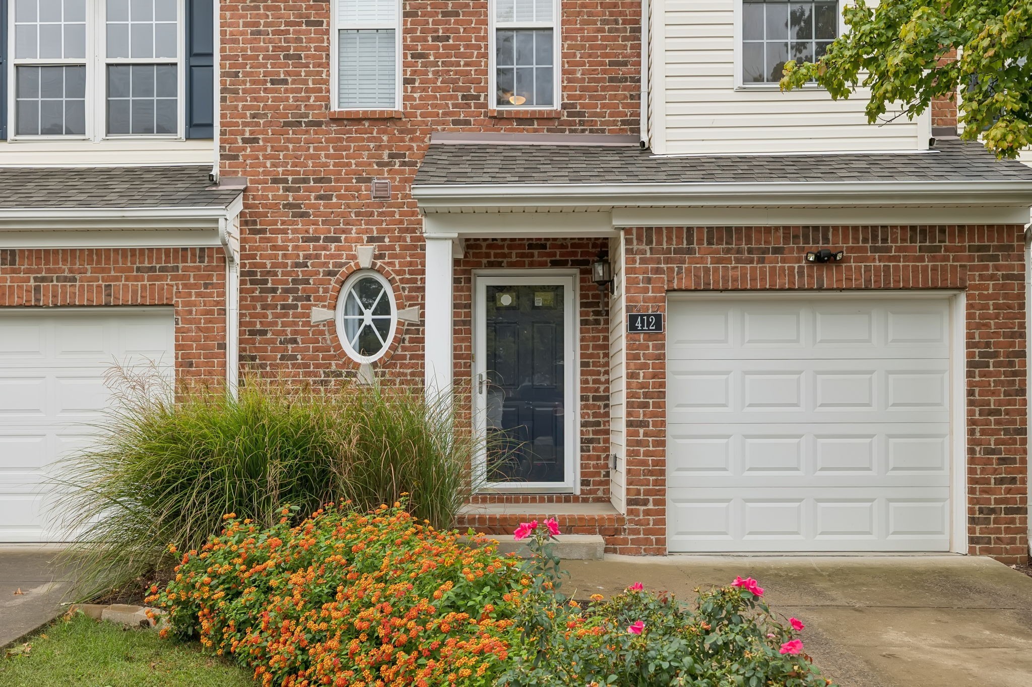 1345 Bell Road, Unit 412 Antioch, TN 37013 - Photo 2 of 33 a front view of a house with plants