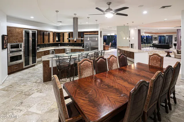 a bathroom with a granite countertop sink a mirror and vanity