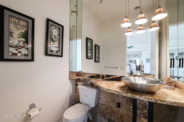 a bedroom with furniture and a flat screen tv