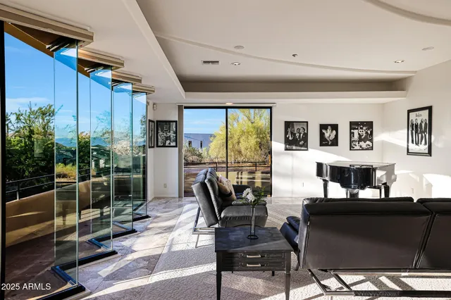 a living room with furniture and a lamp