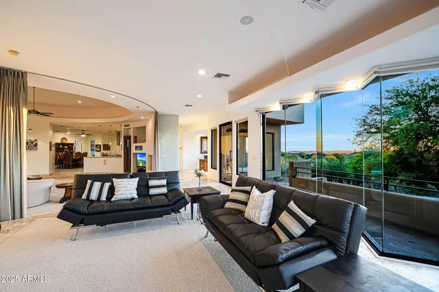 a spacious bathroom with a tub sink and mirror