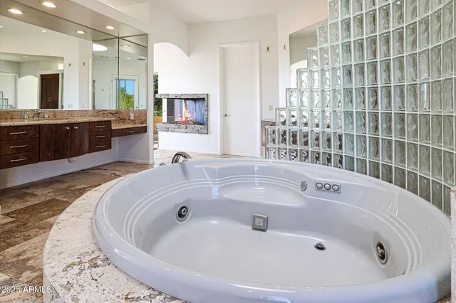 a bathroom with a tub and a shower