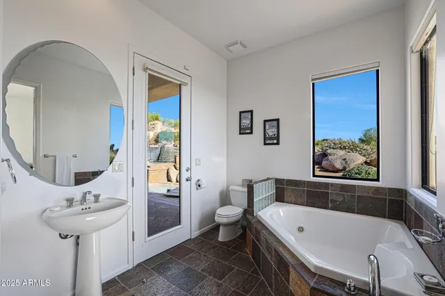 a view of a balcony with furniture