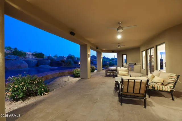 an aerial view of a house with a yard and trees
