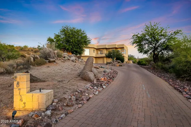 a kitchen with stainless steel appliances kitchen island granite countertop a sink and cabinets
