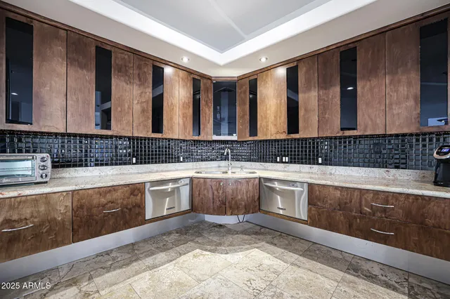 a kitchen with a table and chairs in it