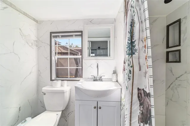 a view of house with outdoor space and swimming pool