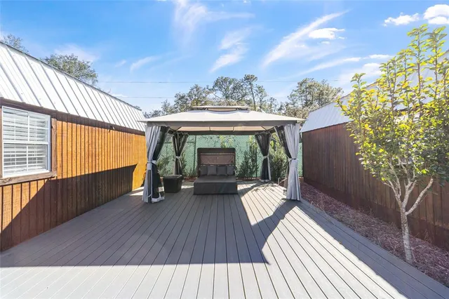 a view of a patio with wooden floor