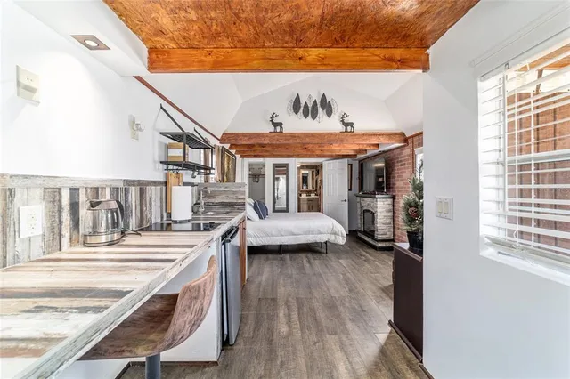 a bathroom with a shower and a sink