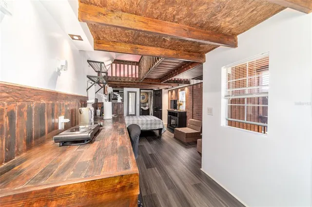 a view of a swimming pool with an outdoor seating and a many windows