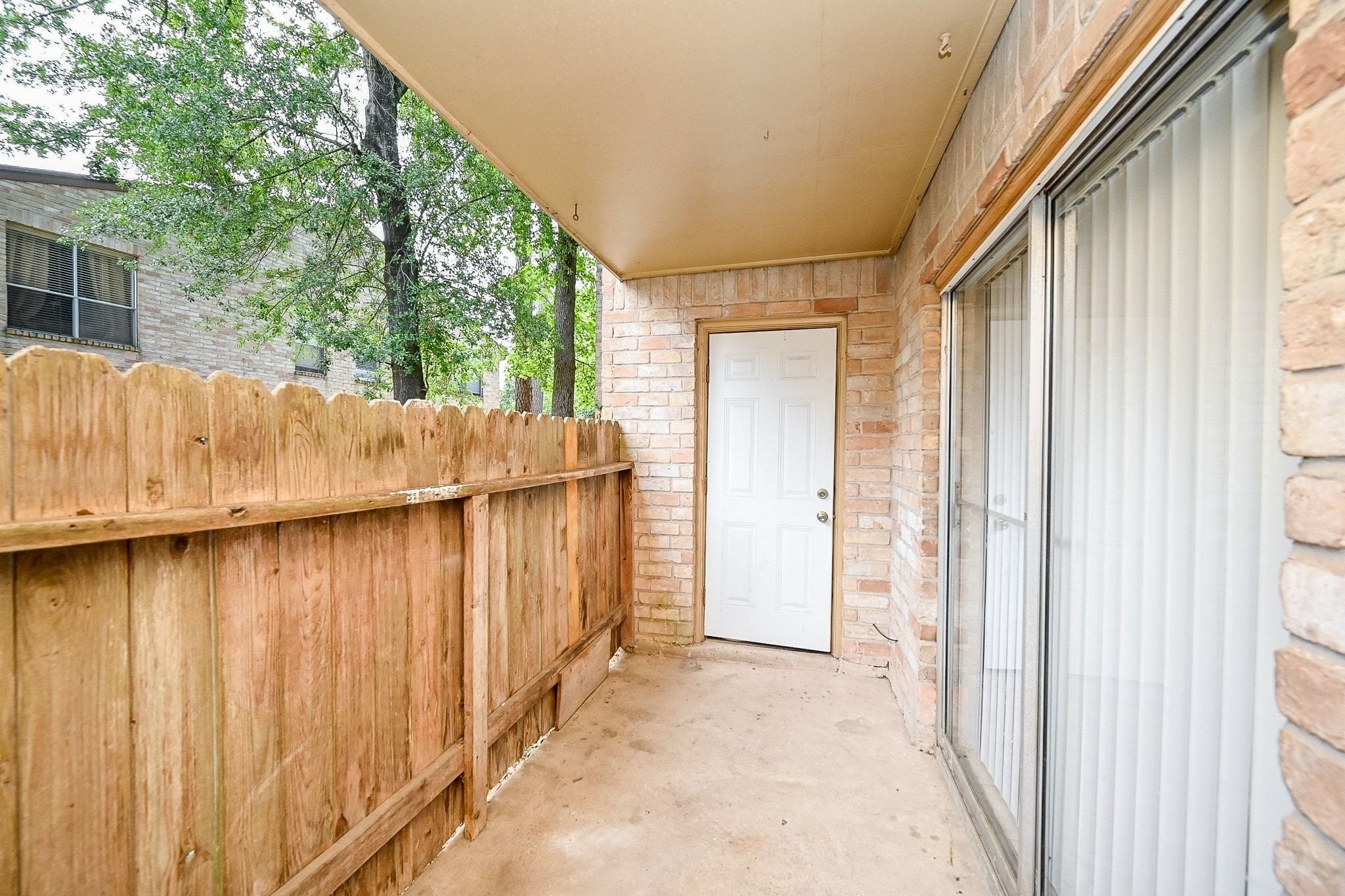 16303 Lyons School Road, Unit 703 Spring, TX 77379 - Photo 2 of 19 a view of outdoor space with wooden fence