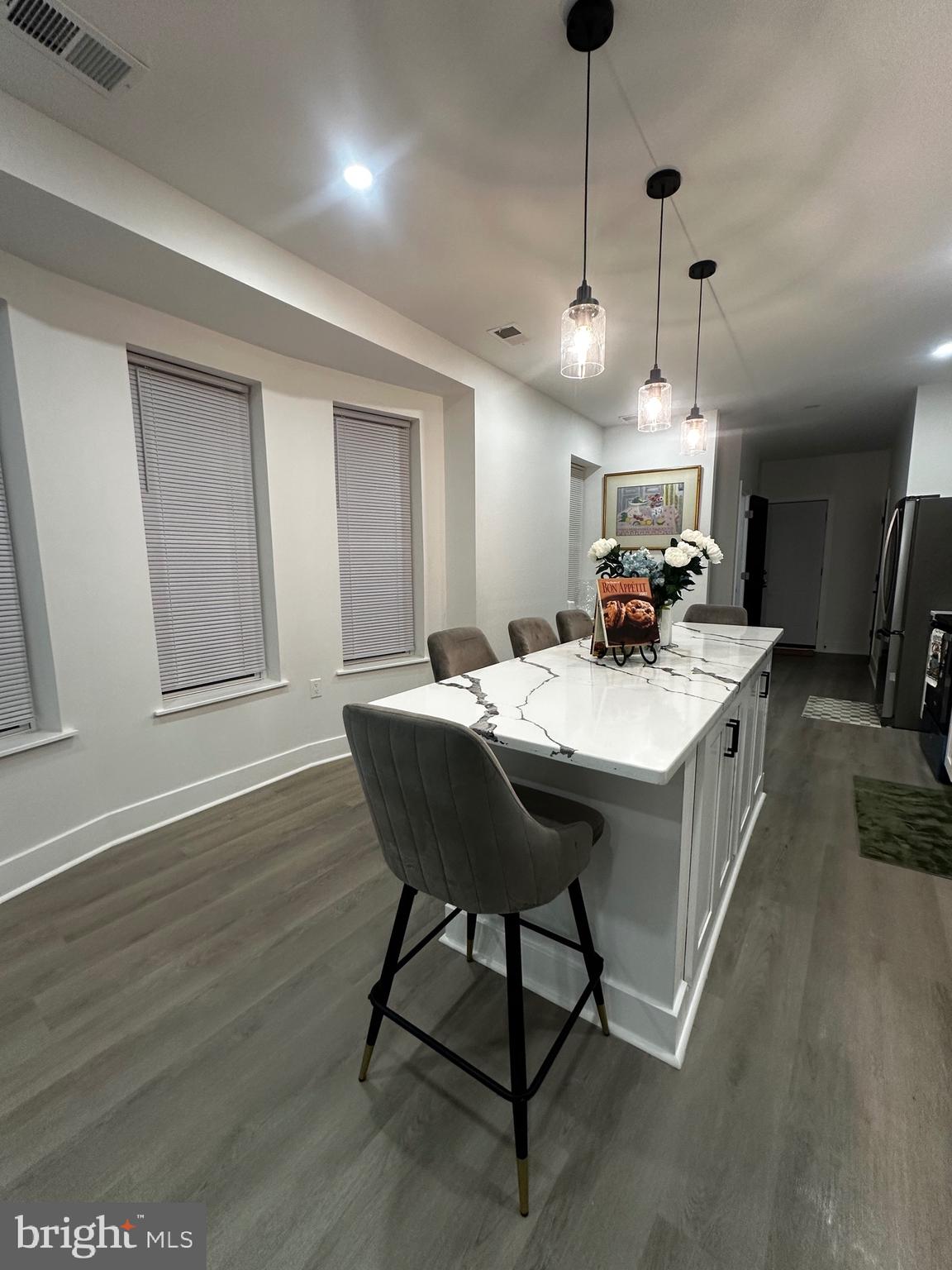 263 South 58th Street Philadelphia, PA 19139 - Photo 11 of 25 a kitchen with a sink a counter space and a dining table
