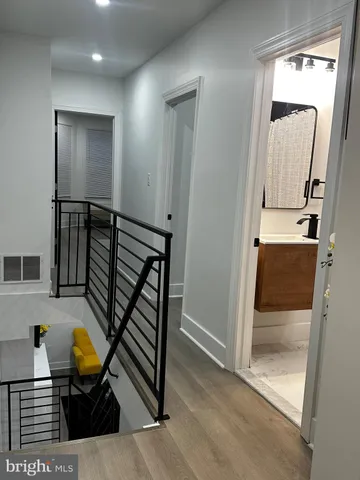 a bedroom with a bed next to a window with outer view